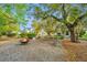 Inviting community space with a fire pit, benches, and mature trees at 5132 E Liberty Park Cir, North Charleston, SC 29405
