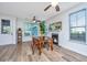 Dining area features a wooden table, natural light, and a decorative fireplace at 5132 E Liberty Park Cir, North Charleston, SC 29405