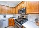 Well-equipped kitchen features stainless steel appliances, gas range, and ample counter space at 5132 E Liberty Park Cir, North Charleston, SC 29405