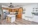 Bright eat-in kitchen with stainless steel appliances, sleek countertops, and wood cabinets at 5132 E Liberty Park Cir, North Charleston, SC 29405