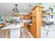 Bright eat-in kitchen with stainless steel appliances, sleek countertops, and wood cabinets at 5132 E Liberty Park Cir, North Charleston, SC 29405