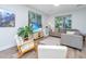 Cozy living room with contemporary furnishings, bright windows, and wood-look flooring at 5132 E Liberty Park Cir, North Charleston, SC 29405