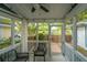Inviting screened porch offers a relaxing space with seating and views of the outdoors at 5132 E Liberty Park Cir, North Charleston, SC 29405