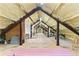 Spacious attic with exposed beams, insulation, and potential for customization and storage at 516 Central Ave, Summerville, SC 29483