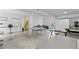 Basement with smooth floor and various tables, utilities, and equipment at 516 Central Ave, Summerville, SC 29483