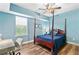 Bright bedroom with a canopy bed, desk, and large window providing ample natural light at 516 Central Ave, Summerville, SC 29483