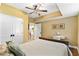 Comfortable bedroom with a queen-sized bed, desk, and view of kitchen area at 516 Central Ave, Summerville, SC 29483