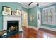 Bedroom featuring a fireplace, hardwood floors, and a view of the bathroom and hallway at 516 Central Ave, Summerville, SC 29483