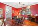 Bright dining room featuring hard wood floors, a piano, and art on the walls at 516 Central Ave, Summerville, SC 29483