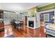 Bright dining room features a chandelier, fireplace and refinished wood floors at 516 Central Ave, Summerville, SC 29483