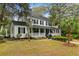 Charming two-story traditional home with a welcoming front porch and beautifully landscaped yard at 516 Central Ave, Summerville, SC 29483