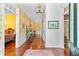 Elegant foyer with hardwood floors, decorative wallpaper, chandelier, and an open view of the home's interior at 516 Central Ave, Summerville, SC 29483