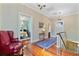 Second floor hallway boasting wood floors and a red leather armchair at 516 Central Ave, Summerville, SC 29483