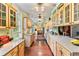 Spacious kitchen with ample storage, refinished wood floors, and a long countertop at 516 Central Ave, Summerville, SC 29483