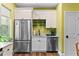 Bright and modern kitchen with stainless steel appliances, white cabinets, and a large sink at 516 Central Ave, Summerville, SC 29483