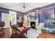 Elegant living room featuring a fireplace, hardwood floors, unique decor, and an open layout at 516 Central Ave, Summerville, SC 29483