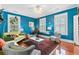 Cozy living room featuring two windows, hardwood floors, and modern decor at 516 Central Ave, Summerville, SC 29483