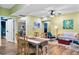 Open-concept living area featuring wood floors, a dining table and seating with stylish decor at 516 Central Ave, Summerville, SC 29483