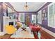 Cozy living room with a fireplace, plush seating, hardwood floors, and ample natural light at 516 Central Ave, Summerville, SC 29483