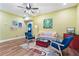 Cozy living room with stylish furniture, a ceiling fan, and natural light at 516 Central Ave, Summerville, SC 29483
