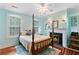 Inviting main bedroom with fireplace, fan, and natural light at 516 Central Ave, Summerville, SC 29483