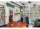 A charming office with a wet bar, hardwood floors, and access to the living room at 516 Central Ave, Summerville, SC 29483