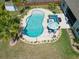 An aerial perspective of the private backyard featuring a pool, patio, and lush landscaping at 5509 Alpine Dr, Summerville, SC 29483