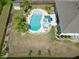 A sprawling backyard with a refreshing pool and outdoor dining area, perfect for relaxation at 5509 Alpine Dr, Summerville, SC 29483