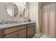 Bathroom featuring double sinks with granite countertops and decorative mirrors at 5509 Alpine Dr, Summerville, SC 29483