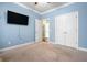 Bedroom with blue walls, a ceiling fan, and access to a closet at 5509 Alpine Dr, Summerville, SC 29483