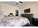 Bedroom featuring a large window, fan, and dresser, with an open doorway to another room at 5509 Alpine Dr, Summerville, SC 29483