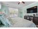 Comfortable bedroom featuring a ceiling fan and a media center for entertainment at 5509 Alpine Dr, Summerville, SC 29483