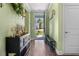 Inviting entryway with hardwood floors, stylish décor, and a view of the home's exterior at 5509 Alpine Dr, Summerville, SC 29483