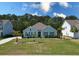 Charming single-story home with well-maintained lawn, mature trees and a manicured landscape at 5509 Alpine Dr, Summerville, SC 29483