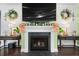 Elegant fireplace with decorative accents and a mounted television at 5509 Alpine Dr, Summerville, SC 29483
