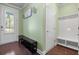 Foyer featuring hardwood floors, storage bench, and a well-lit entry area at 5509 Alpine Dr, Summerville, SC 29483