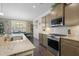 Stylish kitchen featuring granite countertops, stainless steel appliances, and ample cabinet space at 5509 Alpine Dr, Summerville, SC 29483