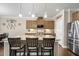 Bright kitchen features a granite island with seating, stainless steel appliances, and wood cabinets at 5509 Alpine Dr, Summerville, SC 29483