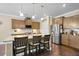 Bright kitchen features a granite island with seating, stainless steel appliances, and wood cabinets at 5509 Alpine Dr, Summerville, SC 29483