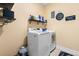Well-lit laundry room with modern washer and dryer units at 5509 Alpine Dr, Summerville, SC 29483
