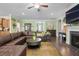 Open-concept living room with a fireplace, comfortable seating, and seamless flow to other areas at 5509 Alpine Dr, Summerville, SC 29483