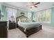 Comfortable main bedroom with a ceiling fan, hardwood furniture, and natural light at 5509 Alpine Dr, Summerville, SC 29483