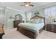 Comfortable main bedroom with a ceiling fan, hardwood furniture, and natural light at 5509 Alpine Dr, Summerville, SC 29483