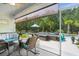Covered outdoor patio with comfortable seating, perfect for relaxing and entertaining near the pool area at 5509 Alpine Dr, Summerville, SC 29483