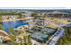 Panoramic aerial view showcasing a lake, tennis courts, clubhouse and homes in the community at 552 Marsh Cv Cir, Summerville, SC 29486