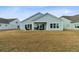Backyard featuring a covered patio, outdoor furniture, and a lush lawn at 552 Marsh Cv Cir, Summerville, SC 29486