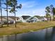 Backyard featuring a covered patio, outdoor furniture, and a view of the water at 552 Marsh Cv Cir, Summerville, SC 29486