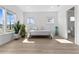 Bright bedroom with large windows, natural light, and light wood floors at 552 Marsh Cv Cir, Summerville, SC 29486