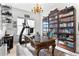Ornate office with a bookshelf, a treadmill, and an ornate wooden desk at 552 Marsh Cv Cir, Summerville, SC 29486