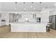 Spacious kitchen featuring a large island, stainless steel appliances, and pendant lighting at 552 Marsh Cv Cir, Summerville, SC 29486